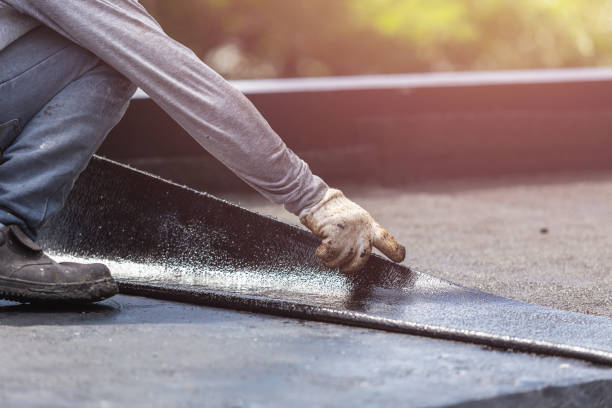 Professional Basement Waterproofing technician working in Burlington, IN